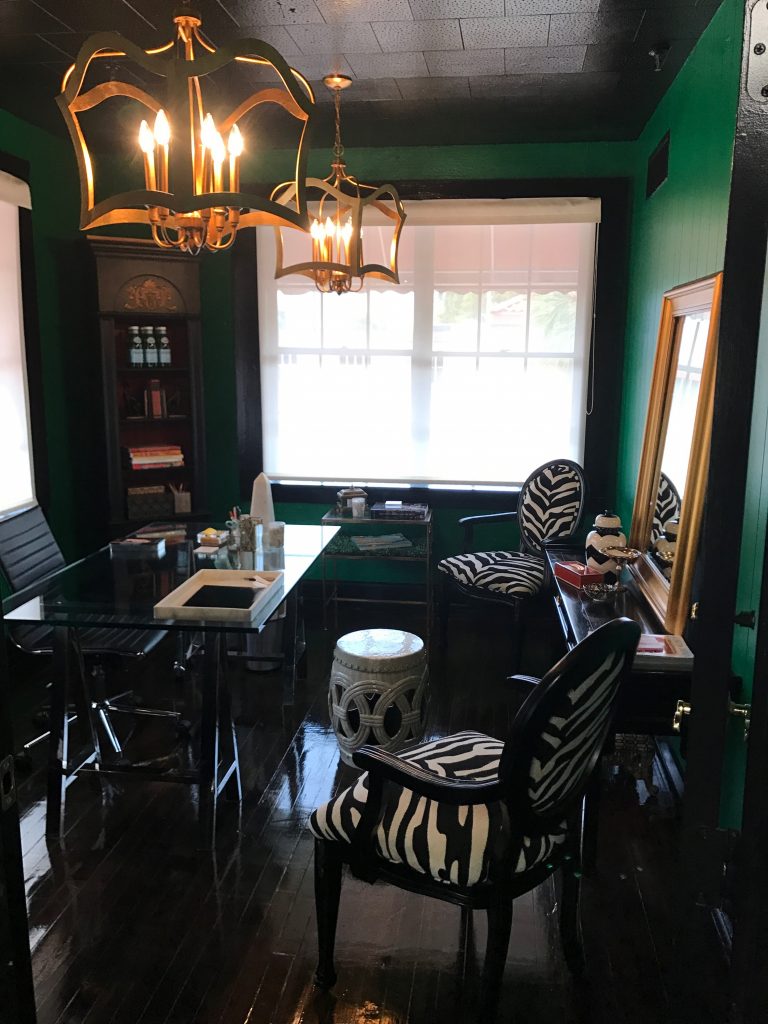 Emerald green office with zebra chairs, interior design in Cocoa, Florida