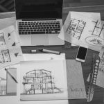 Architectural plans and blueprints with computer, interior designer in Brevard, Michael Gainey Signature Designs