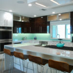 Kitchen with glass backsplash; Michael Gainey Signature Designs